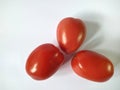 Group of tomatoes on white background