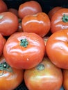 A group of tomatos at fruit market
