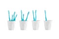 Group of toothbrush in a plastic cup isolated on white background Royalty Free Stock Photo