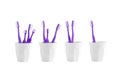 Group of toothbrush in a plastic cup isolated on white background Royalty Free Stock Photo