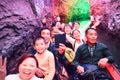 Group tourist boating in cave