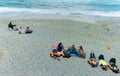 Group of tourist girls lying on beach Italian sunning themselves