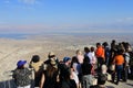 Group of tourist looking at landscape view of the Dead sea and Jordan from Masada Royalty Free Stock Photo