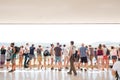 Group of tourist people from behind standing at balustratde look