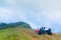 Group of tourist sitting on the top of mountain