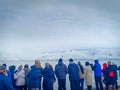 A group of tourist watching beautiful glacier in Antarctica on cruise