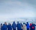 A group of tourist watching beautiful glacier in Antarctica on a cruise ship