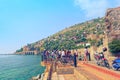 Group of tourists admires the view of ancient shipyard `Tersane` in Alanya