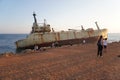 Group of tourists around the Edro III Shipwreck surrounded by the sea in Peyia, Cyprus