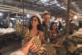 Group Of Tourists Buying Pineapple On Tropical Street Market In Thailand Young People Shopping Fresh Fruits