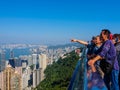 A group of tourists from the Chinese mainland, enjoying the view over Hong Kong from the