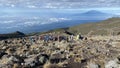 A group of tourists climb up the mountain. Climbing Kilimanjaro, Tanzania, Africa. Beautiful mountain landscape