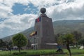 Group of tourists entering the Middle of the World monument near the city of Quito