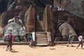 Group of tourists in front of Lion paw at Sigiriya complex Royalty Free Stock Photo