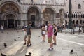 Group of tourists in front of Saint Mark`s Basilica