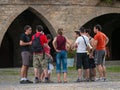 Group of tourists gathered in the Plaza de Ainsa, Huesca.