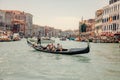 Group of tourists on a gondola riding in Venice, Italy Royalty Free Stock Photo