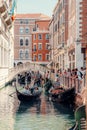 Group of tourists on a gondola riding in Venice, Italy Royalty Free Stock Photo