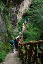 A group of tourists on the landscape corridor mountain path.