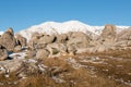 Group of tourists between limestone boulders in high country