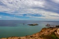 A Group of tourists at a Lookout platform in Monkey Mia, Western Australia. Caucasian girl enjoying cliffs of Indian