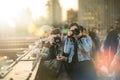 Group of Tourists Photographers on the Brooklyn Bridge during Sunset