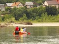 A group of tourists rafting on a mountain river on a pontoon. Tourist routes of Transcarpathia in Ukraine. Rafting on