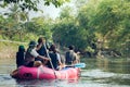 Group of tourists rafting in rubber boats on the canal in thailand Royalty Free Stock Photo