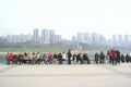 A group of tourists resting on the ancient pier of Ciqikou