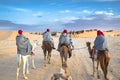 Group of tourists riding on camels. Sahara desert, Douz, Tunisia, Africa.