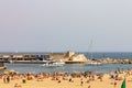 Group of tourists at Somorrostro beach in Barcelona, Spain