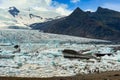 Amazing views of the Fjallsarlon mountains and lakes with large glaciers and icebergs floating in the water in Vatnajokull