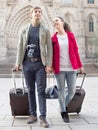 Tourists with suitcases and camera walk in Barcelona Royalty Free Stock Photo