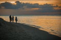 Tourists against a golden sunset at Stone Town, Zanzibar, Tanzania Royalty Free Stock Photo