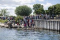 Group of tourists taking photos of The Little Mermaid, Copenhagen, Denmark