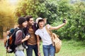 Group of tourists taking a selfie with a phone Royalty Free Stock Photo