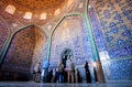 Group of tourists view beautiful interior design of patterned Lotfollah Mosque Royalty Free Stock Photo