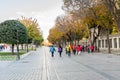 A group tourists visiting the Hippodrome of Constantinople also named Sultan Ahmet Square in the morning in autumn in Istanbul,