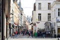 Group of tourists visiting Manneken Pis or Little Man Pee located near Grand Place in the city of Brussels, Belgium