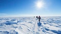 Group of tourists walking on snow in sunny winter day