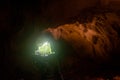 Group of tourists walking in the the wind cave at Gunung Mulu national park. Sarawak.