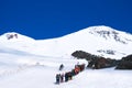 Group of tourists on the way to the mountain Elbrus