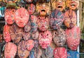 Group of traditional Bali Batik mask hanging for souvenir sell in Ubud market, Bali island of Indonesia. Royalty Free Stock Photo