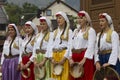 Group of traditional dressed bosnian girls in front of Sebilj fountain