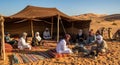 Berber Men Sharing Traditional Mint Tea in a Sahara Desert Tent Royalty Free Stock Photo