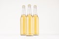 Group transparent longneck beer bottle 500ml with lager, mock up. Royalty Free Stock Photo