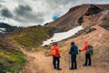 Group of traveler hiking in volcanic mountain among Icelandic Highlands in summer at Landmannalaugar