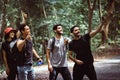 Group of traveler people selfie with mobile phone at rain forest together,Happy and smiling,Enjoying backpacking concept