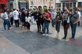 Group of traveler visit Footprint and hand prints of Superstar at Graumans TCL Chinese Theater in Hollywood, Los Angeles.