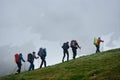 Group of travelers climbing the mountain. Royalty Free Stock Photo